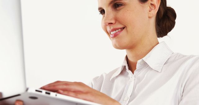 Smiling Professional Woman Using Laptop in Office - Download Free Stock Photos Pikwizard.com