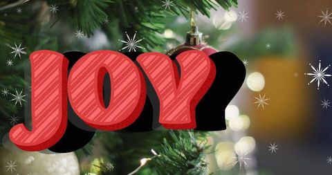 Festive christmas tree with red joy letters and sparkling decoration