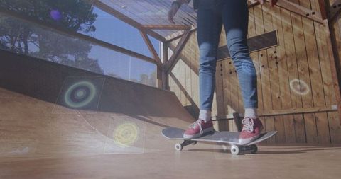 Skateboarder balancing on ramp with digital graphics