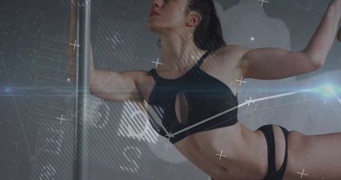 Athlete Performing Pole Fitness with Digital Technology Overlay