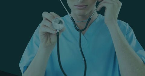 Medical Professional in Scrubs Using Stethoscope for Diagnosis