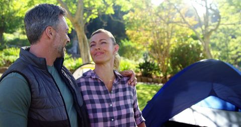 Middle-Aged Couple Enjoying Camp Site in Nature
