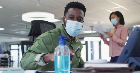 Office Worker with Face Mask Using Tablet During Pandemic - Download Free Stock Images Pikwizard.com
