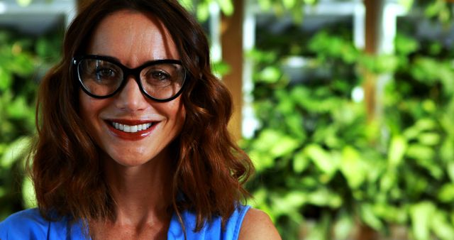 Smiling Woman with Glasses in Garden Environment - Download Free Stock Images Pikwizard.com