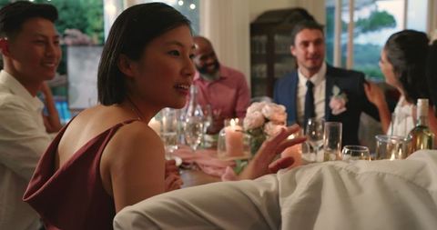 Elegant Wedding Dinner with Guests Sharing Joyful Moments