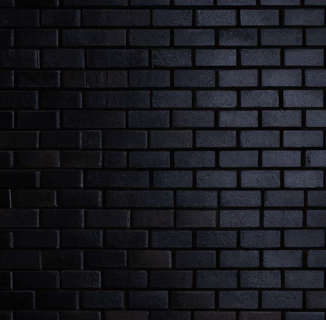 Close up of black brick walls created using generative ai technology. Texture, colour and pattern concept, digitally generated image.