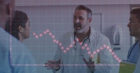 Medical team analyzing trends with data overlay in hospital setting