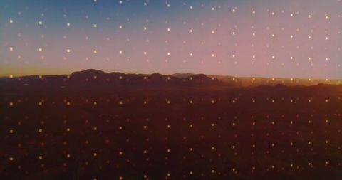 Futuristic Desert Plateau at Dusk with Digital Grid Overlay