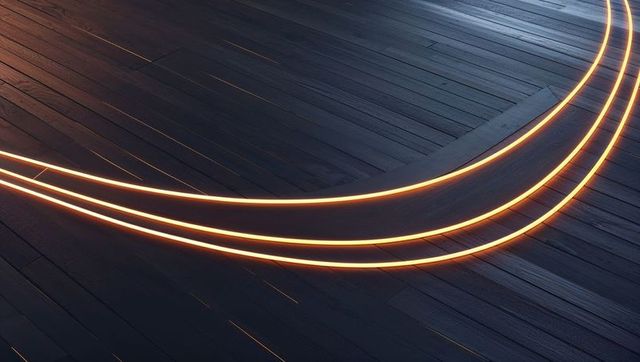 Curving Glowing Light Trails on Dark Wooden Floor
