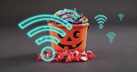 Halloween pumpkin bucket overflowing with colorful candy and glowing neon wifi symbols