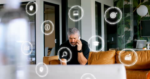 Caucasian Businessman with Digital Technology Icons in Modern Office
