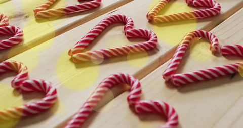 Candy Cane Heart Shapes on Wooden Surface With Bokeh Lights - Download Free Stock Images Pikwizard.com