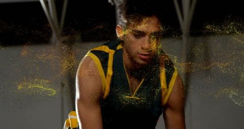 Dynamic basketball action with golden particle effect