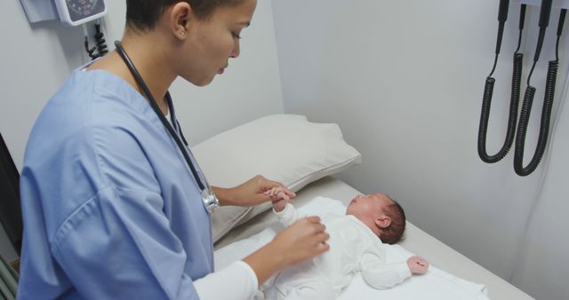 Nurse checking newborn baby on exam table in hospital - Download Free Stock Images Pikwizard.com