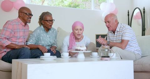 Cancer Survivor Celebrating Birthday with Senior Friends at Home Gathering