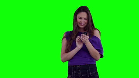 Smiling Woman Texting on Smartphone with Green Screen Background