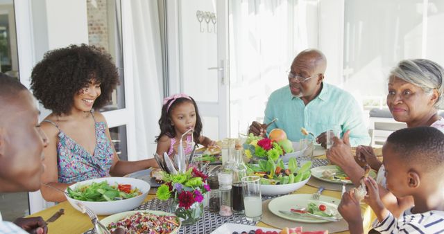 Image of african american family spending time together and having dinner outside. Family life, spending time together with family.
