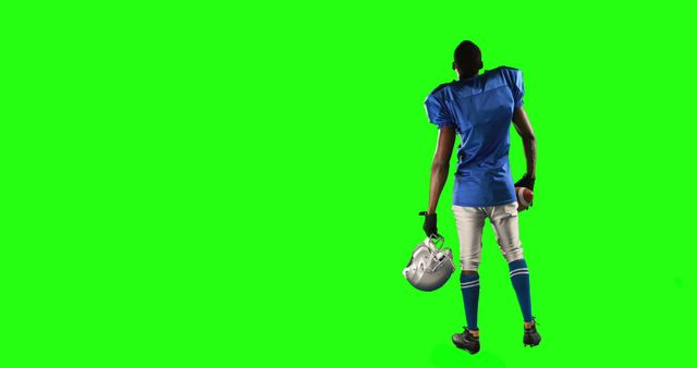American Football Player in Blue Uniform Holding Helmet on Green Screen Background - Download Free Stock Images Pikwizard.com