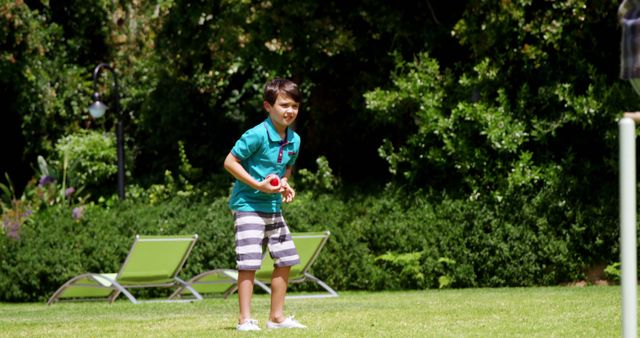 Boy Playing Lawn Game in Sunny Garden - Download Free Stock Images Pikwizard.com