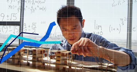 Architect Analyzing Model with Financial and Mathematical Data - Download Free Stock Images Pikwizard.com