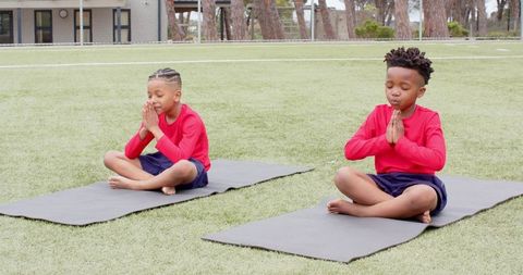 Children Practicing Meditation Outdoors on Yoga Mats