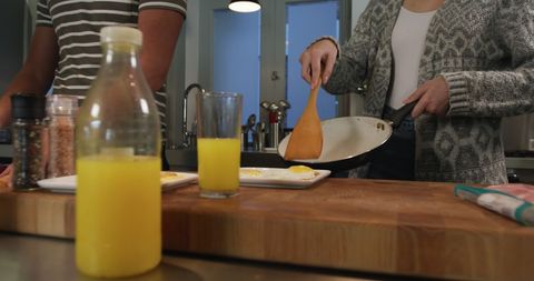 Couple Preparing Breakfast Together in Stylish Modern Kitchen