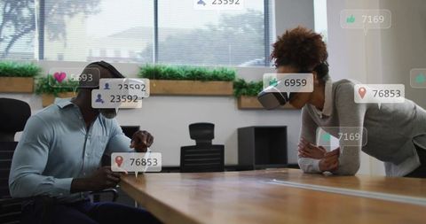 Team collaborating with vr headsets at boardroom table showing ar overlays and metrics