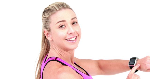 Smiling Woman in Pink Fitness Wear using Smartwatch - Download Free Stock Images Pikwizard.com