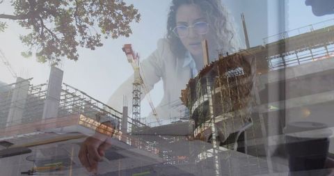 Women in blazers reviewing blueprints with construction cranes and scaffolding overlay