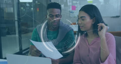 Team Collaborating with Digital Overlay in Modern Office Workspace