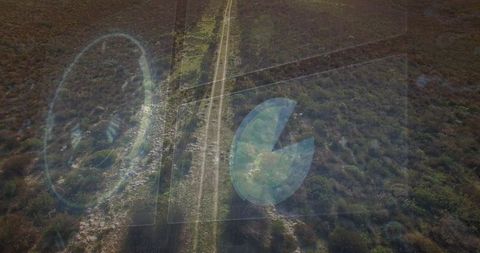Aerial view of rural road with futuristic hud elements
