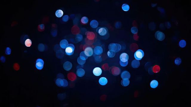 Abstract blue and red bokeh on dark background