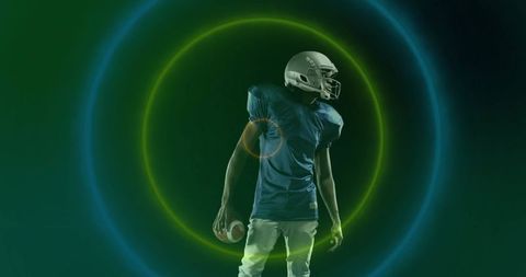 Futuristic Football Player Holding Ball in Neon Light
