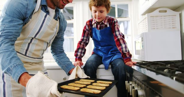 Father Bonding with Son Baking Cookies in Kitchen - Download Free Stock Images Pikwizard.com