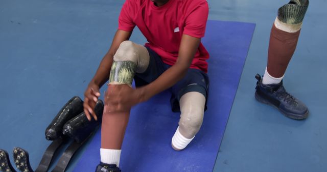 Athlete with Prosthetic Legs Preparing for Training - Download Free Stock Images Pikwizard.com