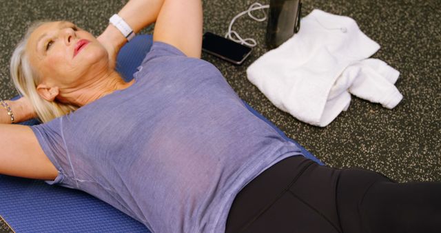 Senior Woman Exercising on Yoga Mat in Gym - Download Free Stock Images Pikwizard.com