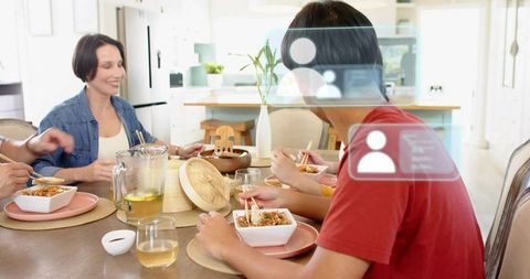 Family Sharing Meal With Augmented Reality Social Overlay in Bright Modern Kitchen