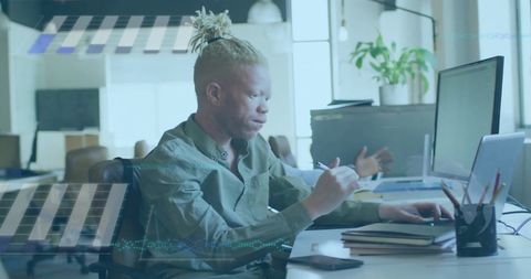 Albino Businessman Analyzing Financial Data in Modern Office
