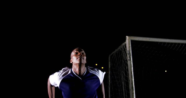 Football Player Training at Night in Low Light - Download Free Stock Images Pikwizard.com