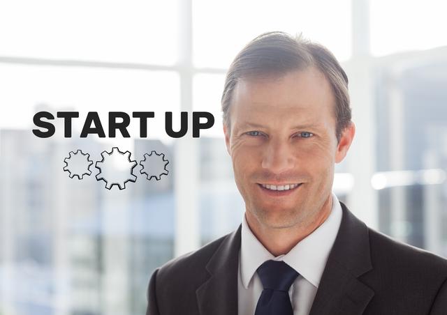 This image shows a smiling businessman in a suit with a startup concept text and gear icons overlay. Ideal for use in business startup promotions, entrepreneurial motivation, corporate presentations, and business development materials.