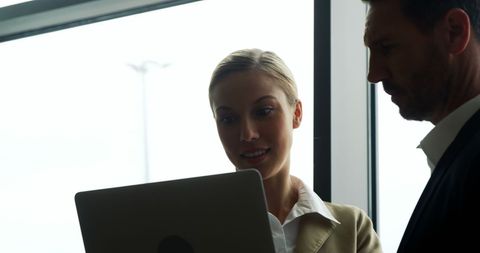 Business Professionals Collaborating at Airport