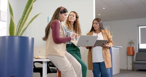 Diverse Female Colleagues Having Office Discussion