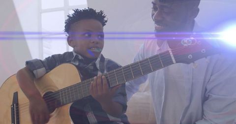 Father and Son Bonding Over Guitar in Sunlit Living Room