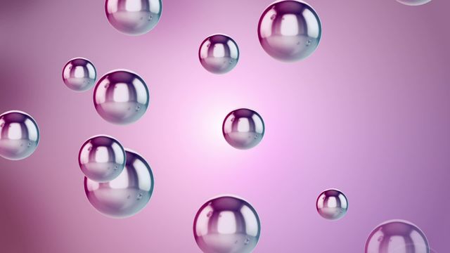 Metallic pink bubbles floating against a purple gradient backdrop. Ideal for backgrounds, digital artwork, abstract designs, or science and technology visuals.