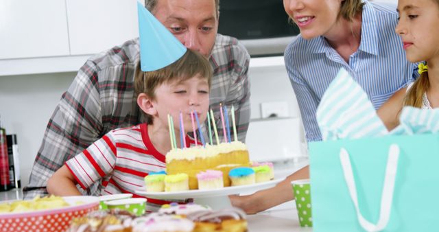 Boy celebrating birthday with family