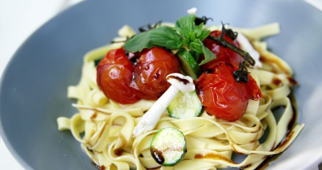 Delicious Fettuccine Pasta with Cherry Tomatoes and Mozzarella - Download Free Stock Images Pikwizard.com