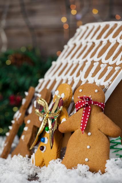Gingerbread house and cookies arranged together during christmas time