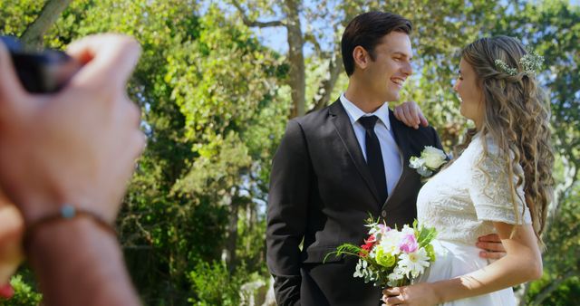 Bride and Groom Pose for Wedding Photos Outdoors in Lush Garden - Download Free Stock Images Pikwizard.com