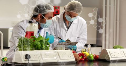 Scientists analyzing food samples in laboratory setting