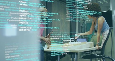 Design team collaborating on architecture model with code overlay